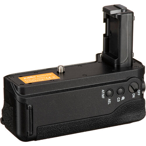 Battery compartment open, showing the two slots for NP-FW50 batteries.