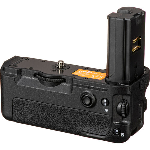 Photographer's hand holding a Sony camera with the Jupio grip attached for vertical shooting.