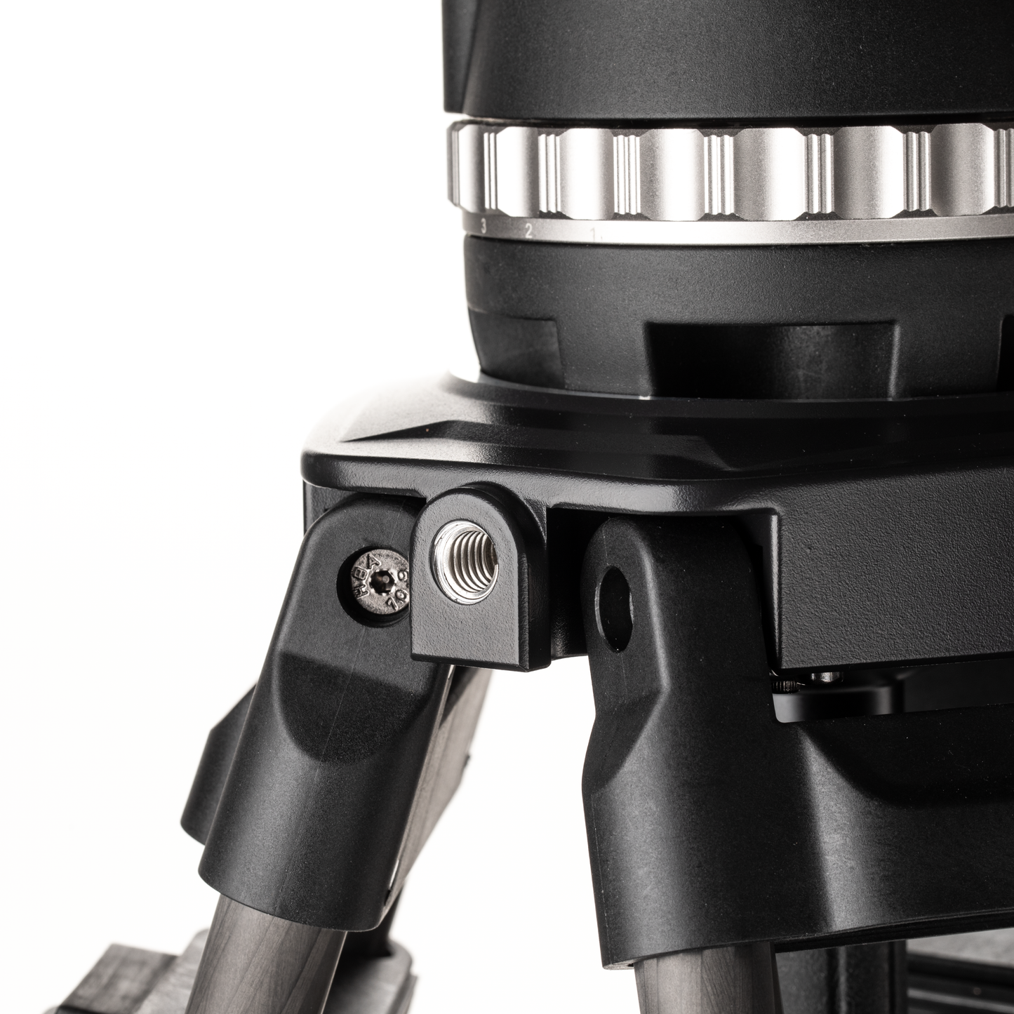 Hand adjusting the flip lock on a carbon fiber leg section of the BVX18 tripod.