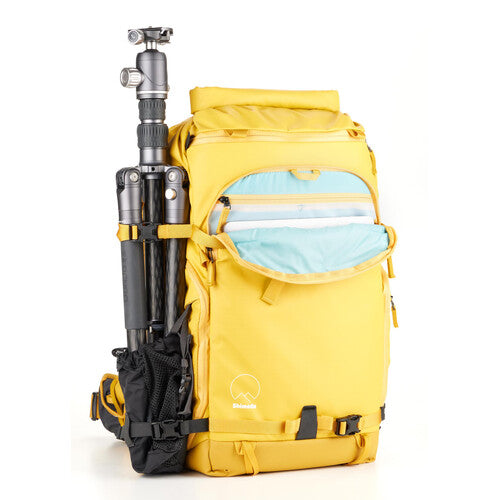 Yellow Shimoda backpack with dual padded laptop and tablet sleeves fitting devices up to 16 inches.