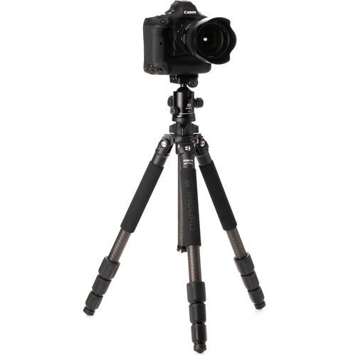 Professional photographer using Induro tripod with telephoto lens
