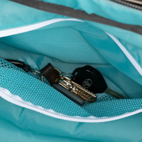 Shimoda DV Roller side pockets with passport and smartphone slots for travel convenience