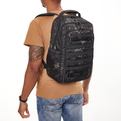 Lifestyle shot of the Tenba Axis v2 16L bag being carried as a professional travel daypack.