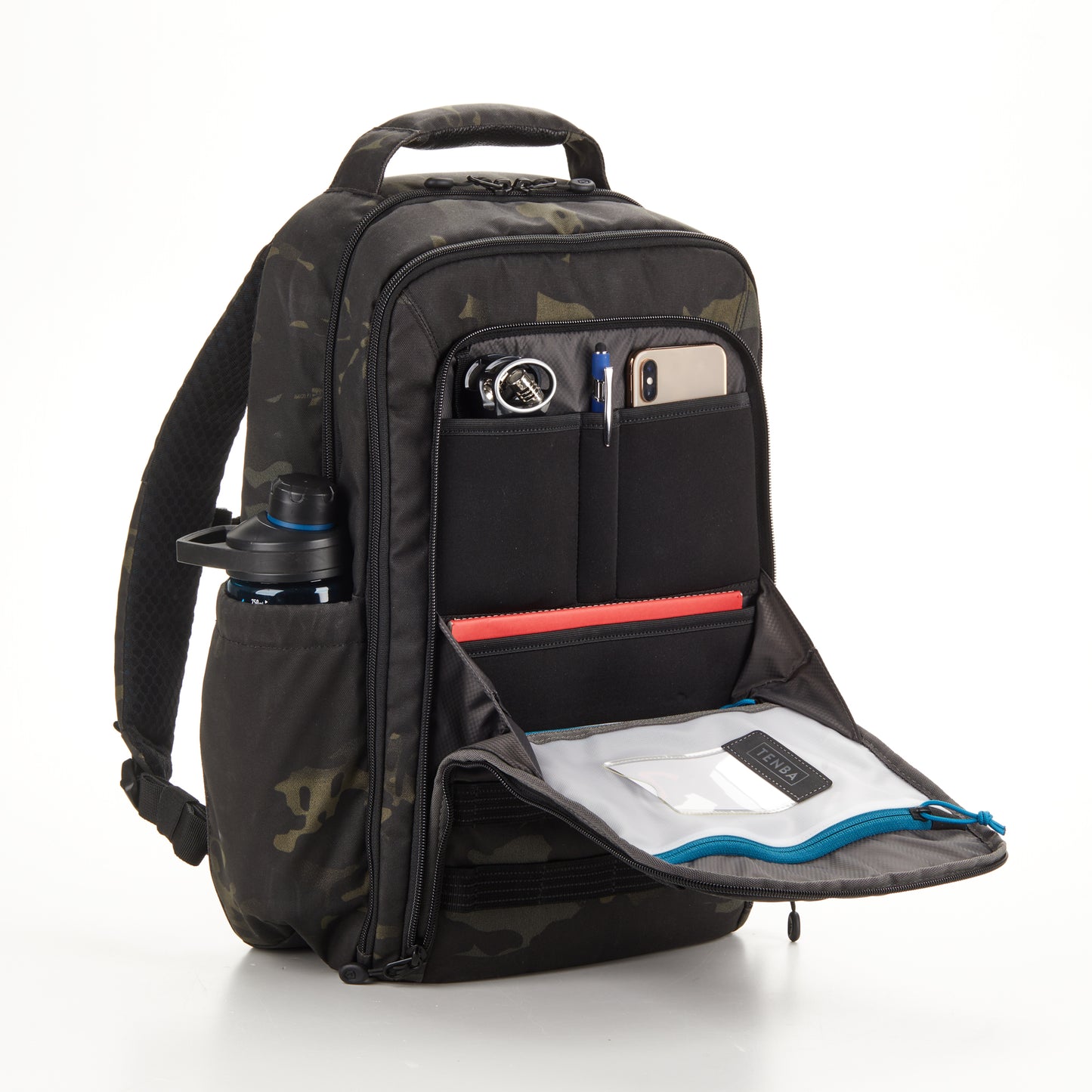 Top-down view of organized pockets containing a passport, wallet, notebook, and business cards.