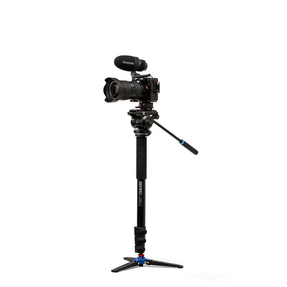 DSLR Camera on a monopod with a white background