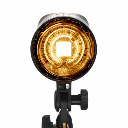 Photographer adjusting Elinchrom OCF modifier on the THREE flash