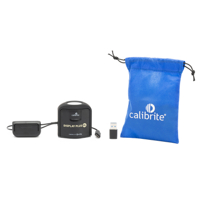 Calibrite display calibration kit with black device, USB cable, and blue drawstring bag 
