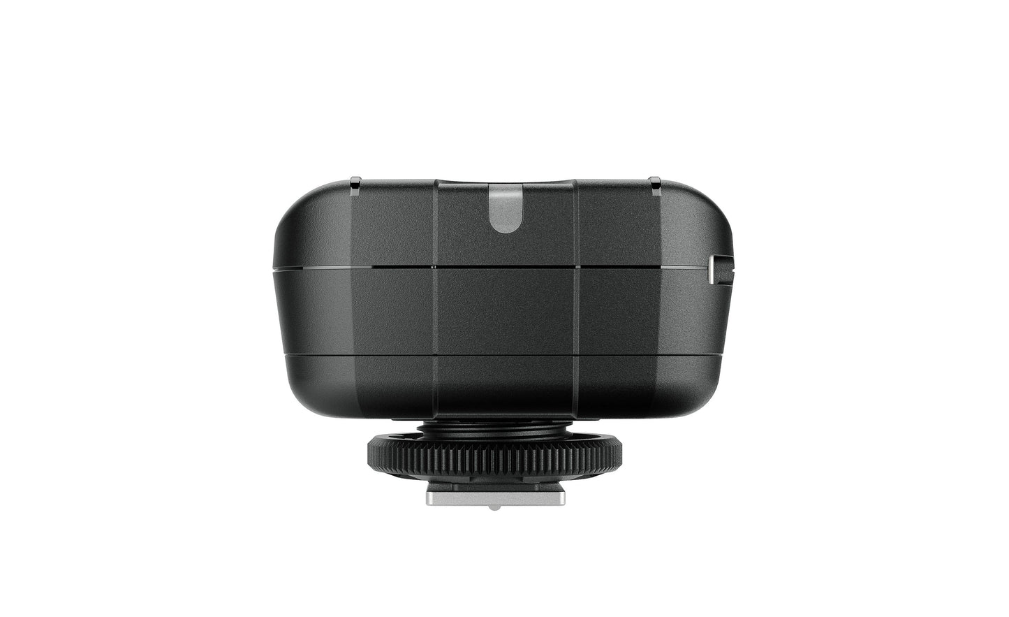 Size comparison of the Elinchrom Skyport Plus transmitter next to a DSLR camera.