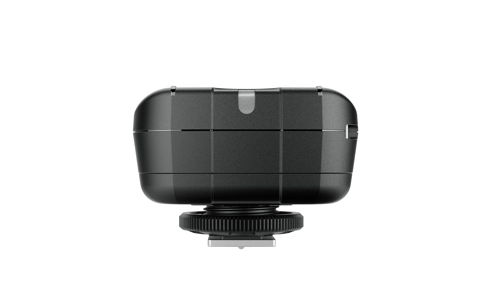 Size comparison of the Elinchrom Skyport Plus transmitter next to a DSLR camera.