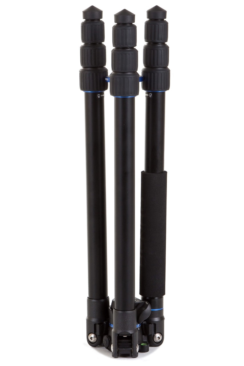 Compact Benro FGP28A tripod with reverse-folded legs for travel and storage.