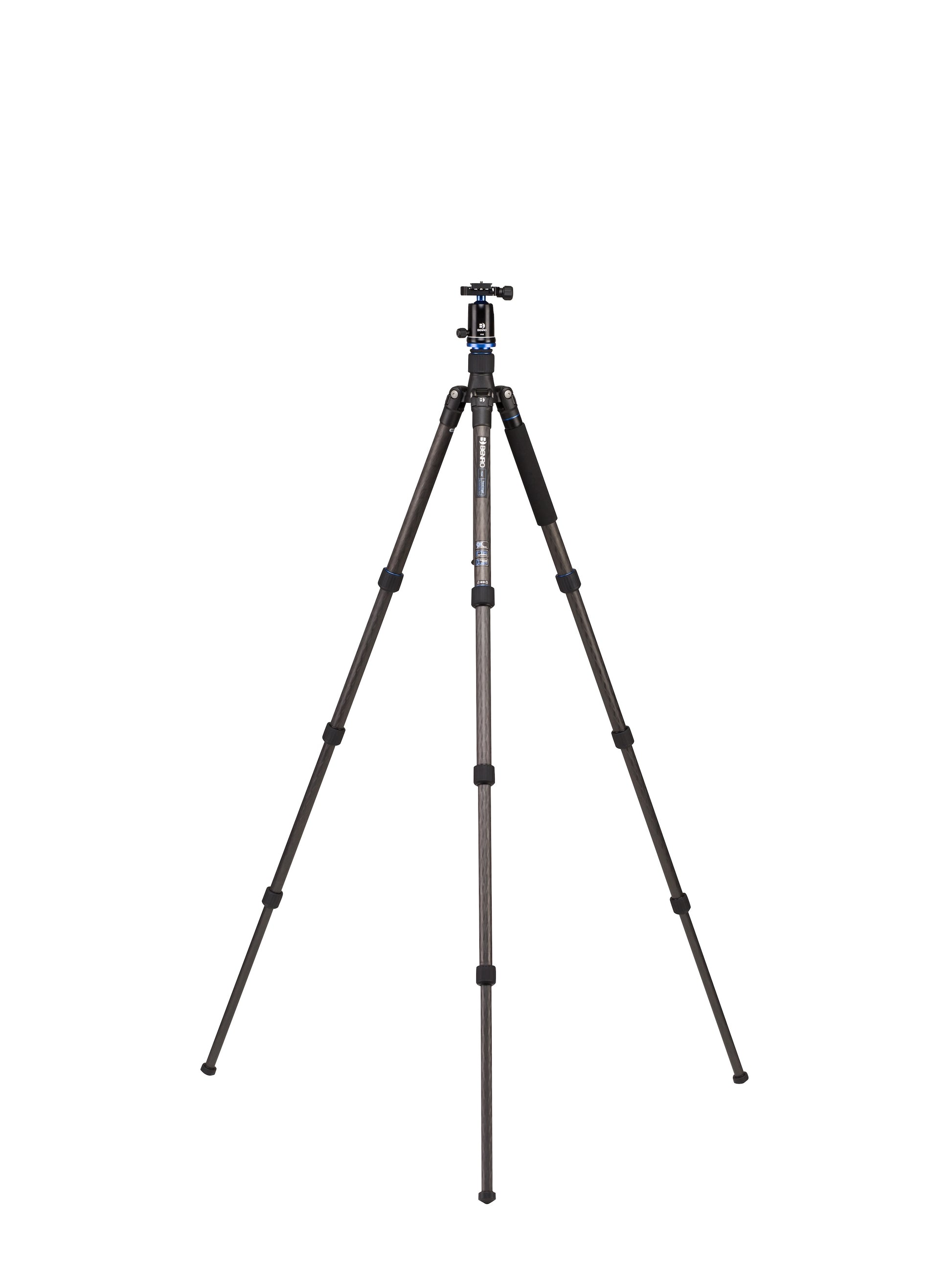 The tripod extended to its full height next to a person for scale.