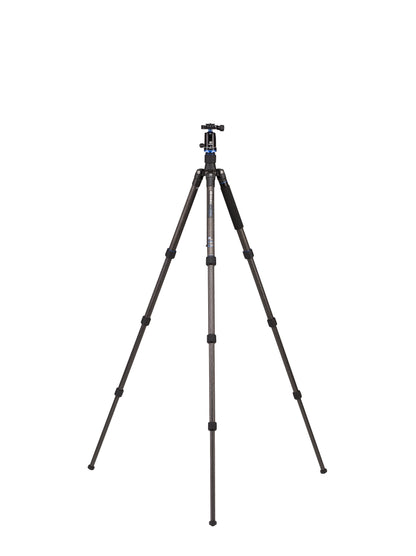 The tripod extended to its full height next to a person for scale.
