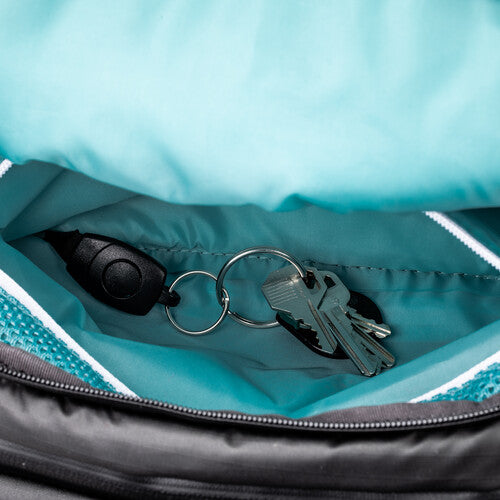 Close-up detail of the adjustable torso height mechanism on the backpack harness.