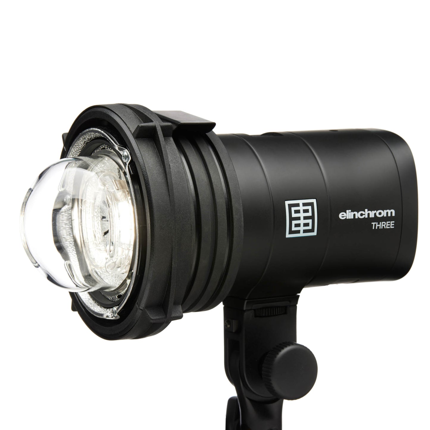 Photographer holding Elinchrom THREE flash for on-location shoot
