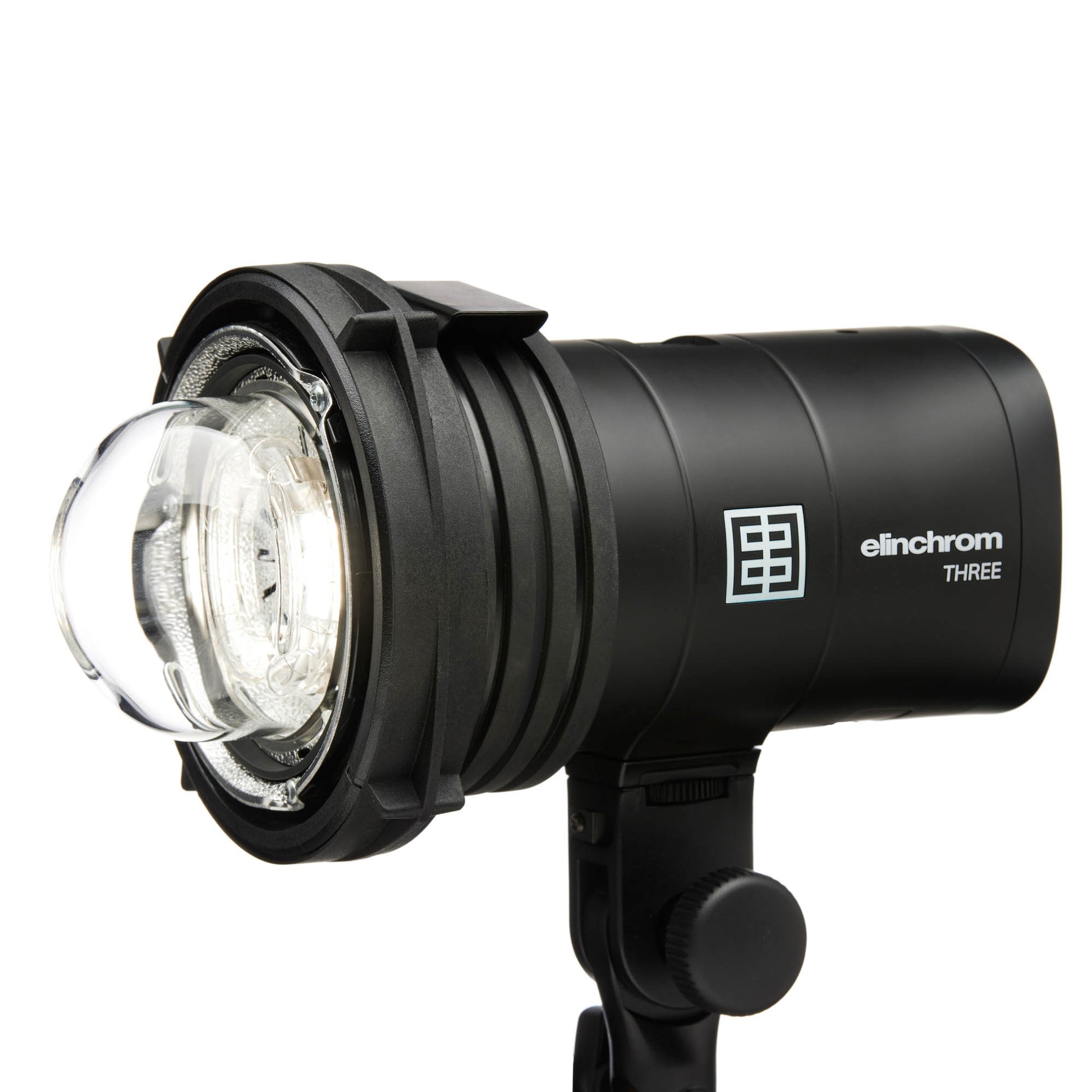 Photographer holding Elinchrom THREE flash for on-location shoot