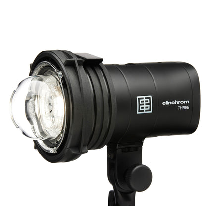 Photographer holding Elinchrom THREE flash for on-location shoot