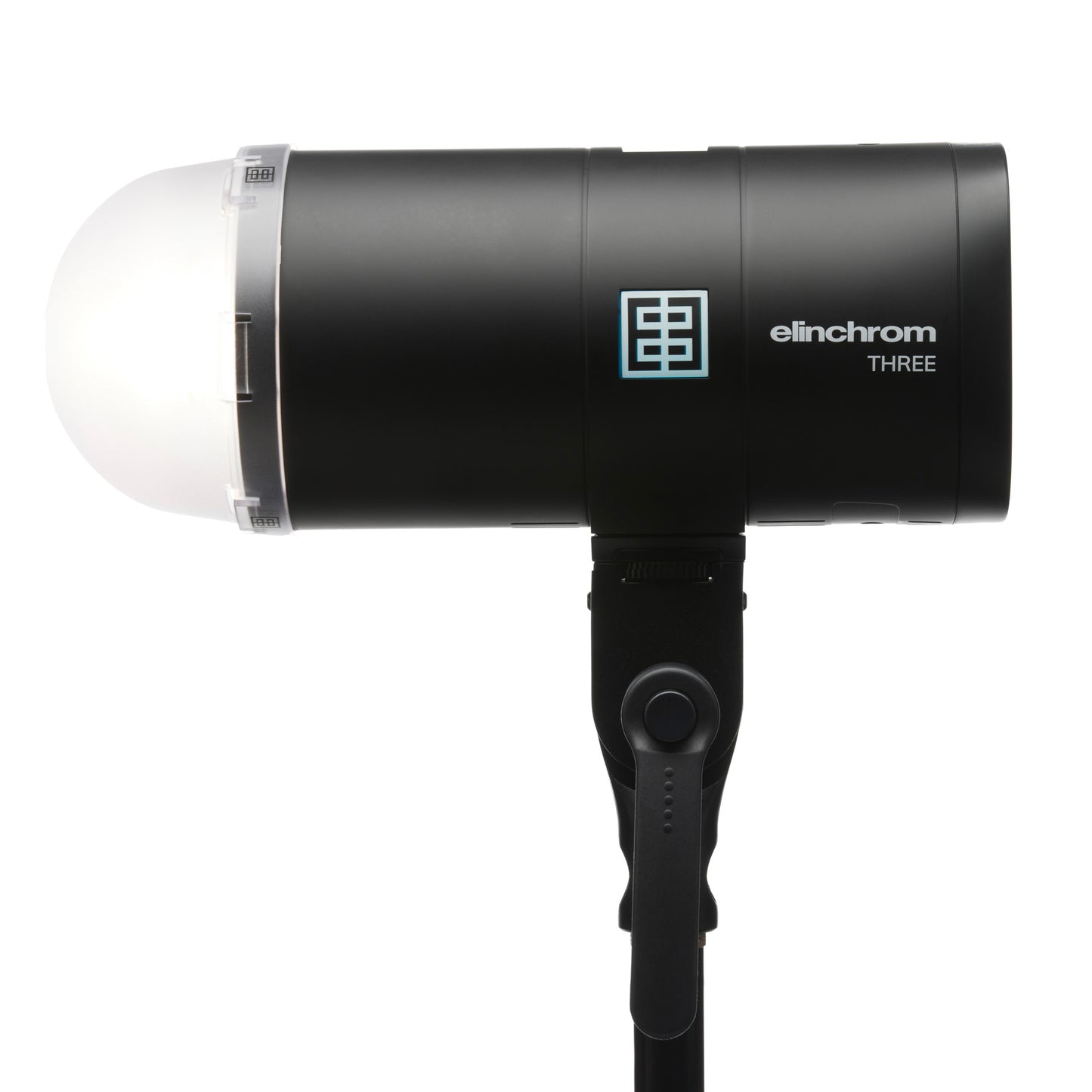 Photographer using Elinchrom THREE with a color gel for creative effects