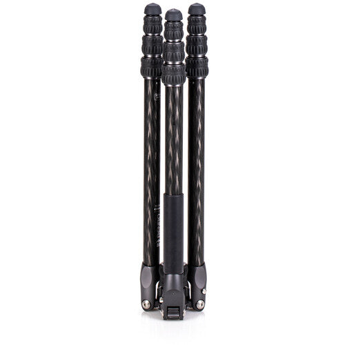 Portable carbon fiber tripod folded for outdoor landscape photography.