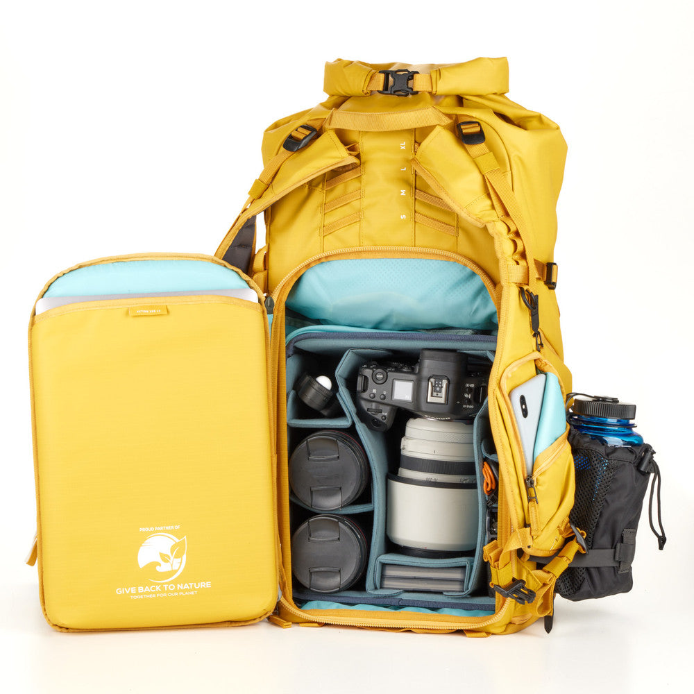 Action X50 Backpack with Core Unit v2, securely holding a DSLR camera and lenses.
