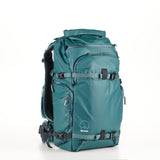 Teal Shimoda Action X30 V2 backpack with removable pouches for tripod or water bottle storage.