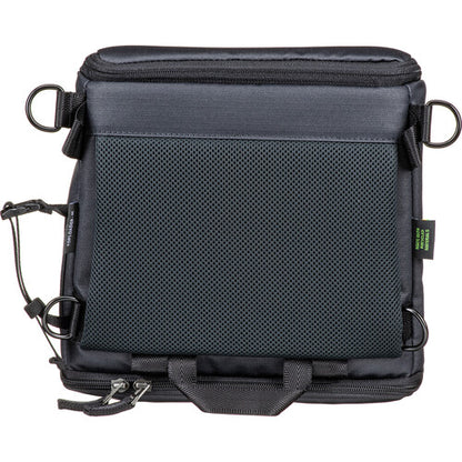 Shimoda Designs Top Loader worn as a front chest pack using accessory straps.