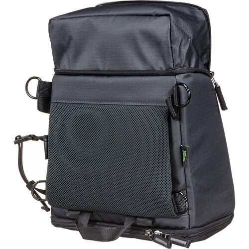 Water-resistant Shimoda Designs Top Loader attached to a backpack waist belt as a hip pack.