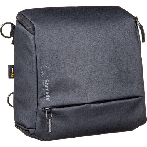 Shimoda Designs Top Loader camera bag holding a DSLR with a 70-200mm lens attached.