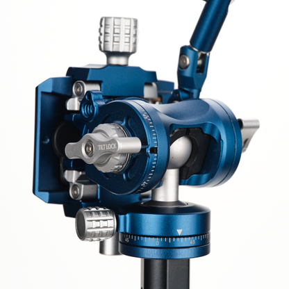 Close-up of a blue and silver mechanical video tripod head