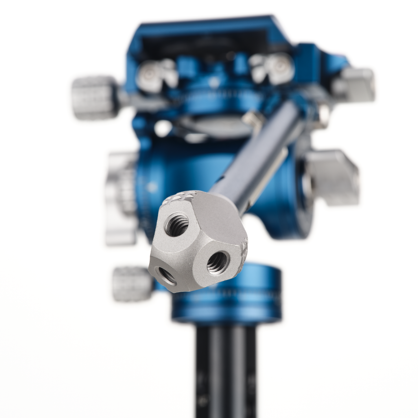 A close-up view of a blue and silver mechanical component, specifically a tripod head.