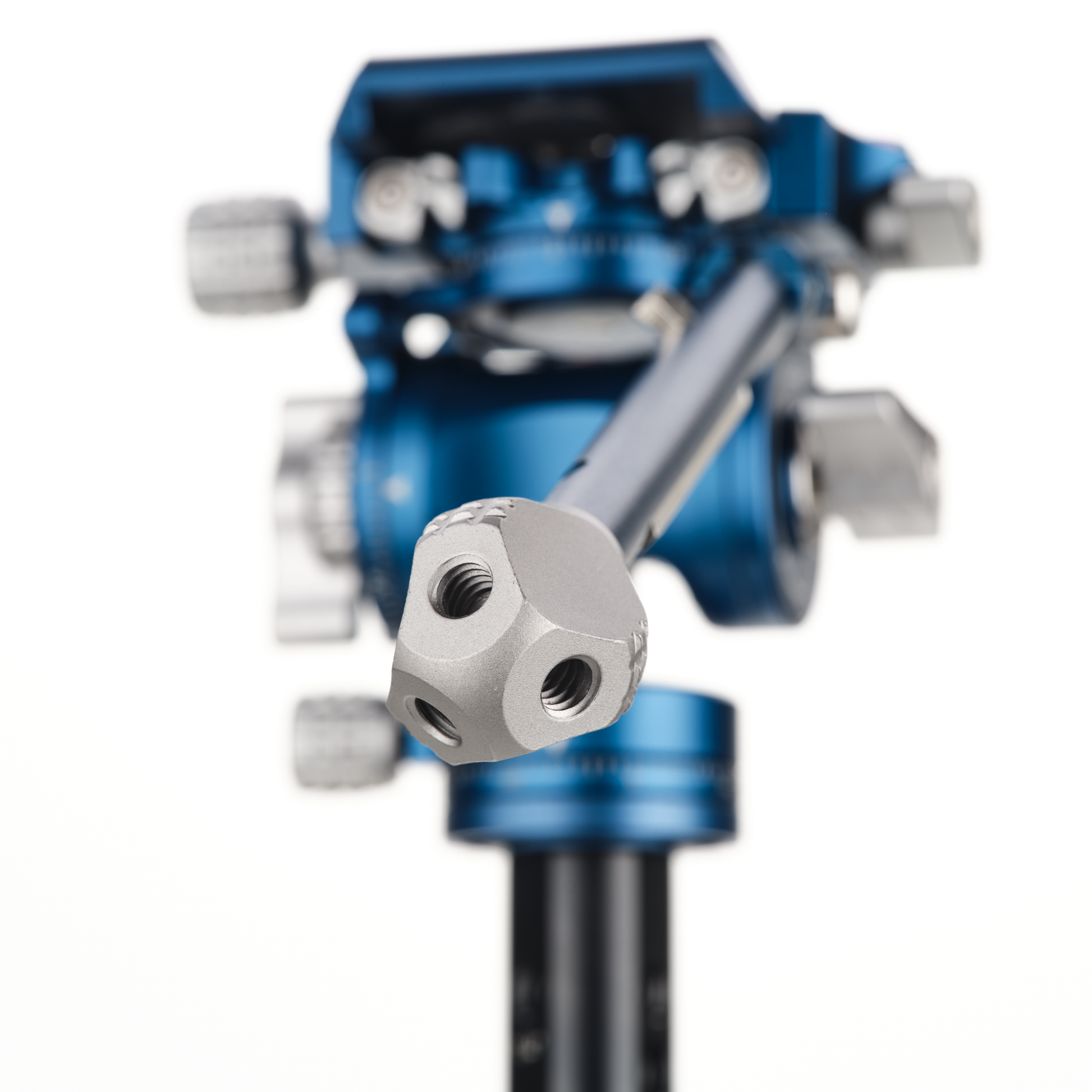 A close-up view of a blue and silver mechanical component, specifically a tripod head.