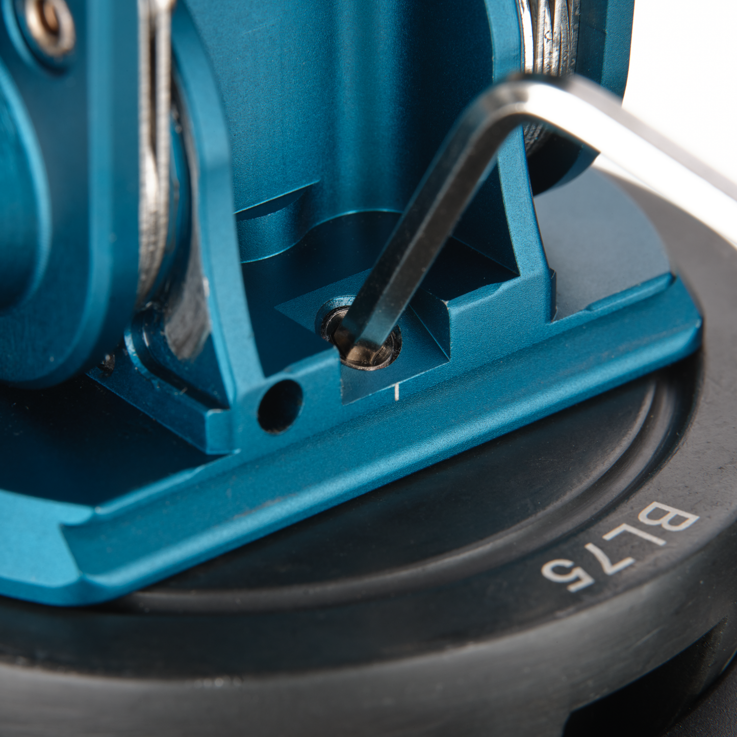 Close-up of a blue circular saw blade with 'BL75'