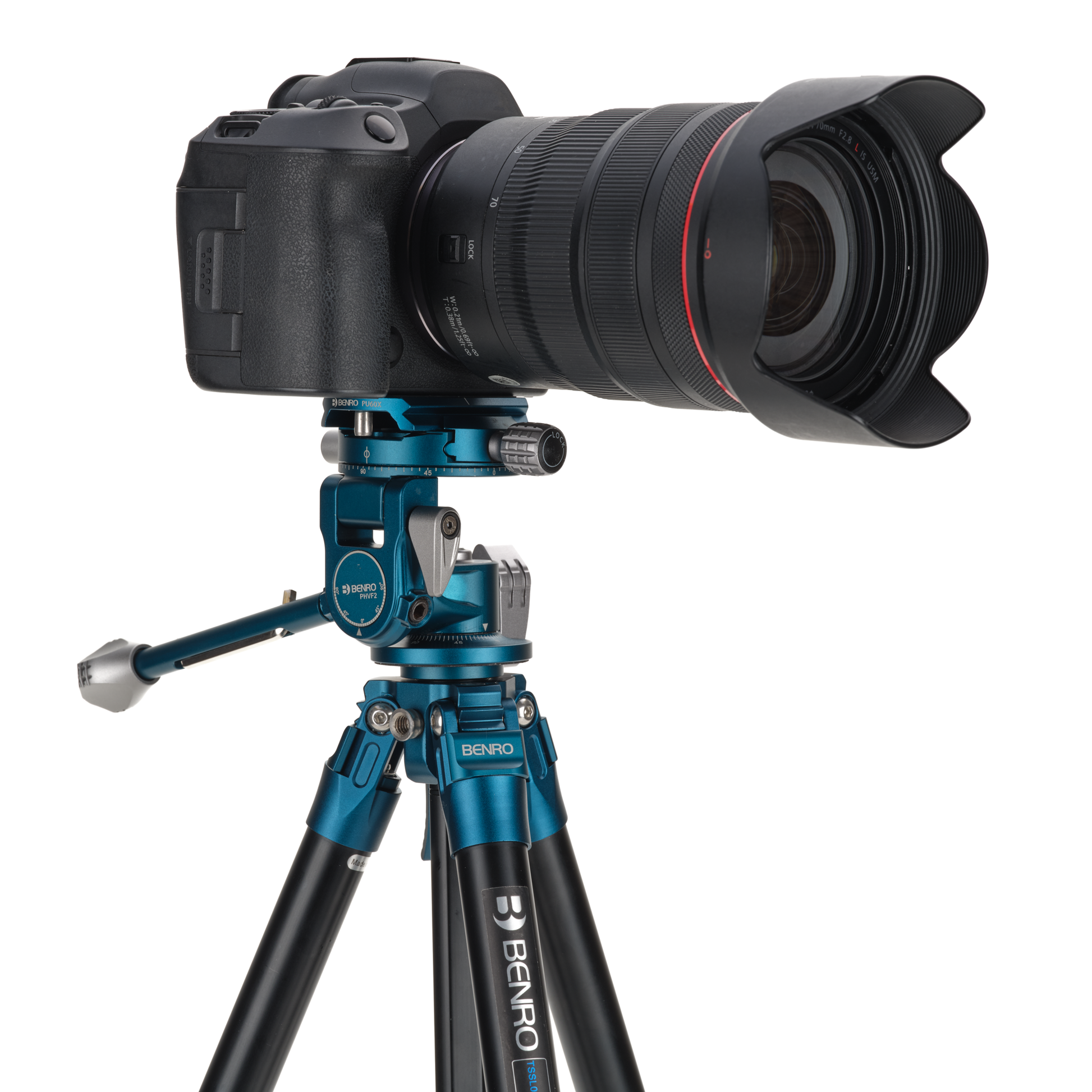 Tripod in use outdoors, capturing a landscape photo with a mirrorless camera.