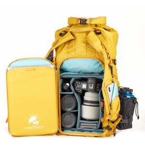 Front View of Action X50 V2 Backpack in Yellow – A vibrant yellow Shimoda Designs backpack with a streamlined front view, showcasing its roll-top design and durable build.