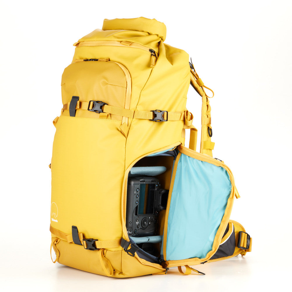 Action X50 Backpack with a water bottle in the removable side pouch for easy access.
