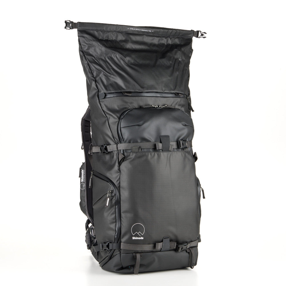 Action X50 Backpack in a mountain setting, showcasing its rugged design for outdoor adventures.