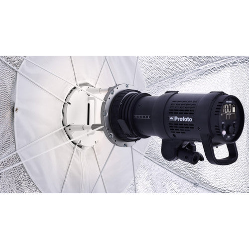 Studio light with umbrella diffuser on a textured white background