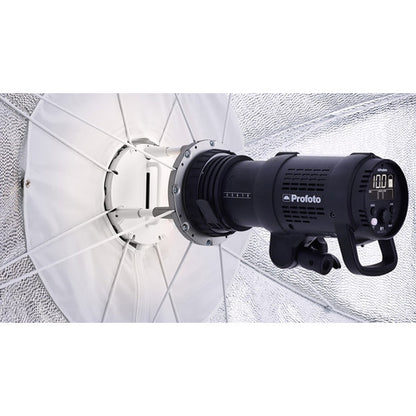 Studio light with umbrella diffuser on a textured white background