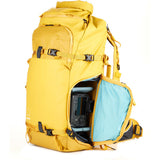 Backpack with Helmet Holder Attached – Side view of the backpack with an attached helmet on the removable helmet holder, showcasing its versatility for bikers or skiers.