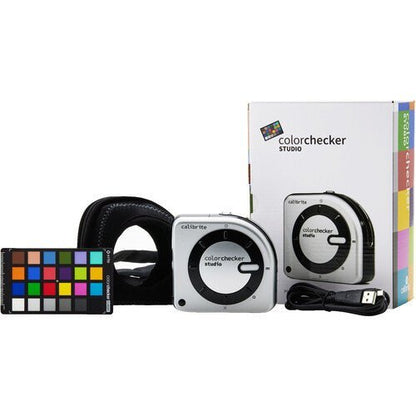 Calibrite ColorChecker Studio kit with ccColorimeter and ColorChecker Classic Mini target on a desk.