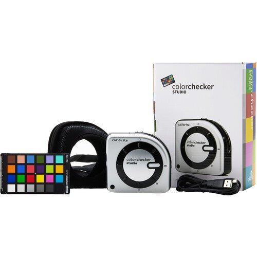 Calibrite ColorChecker Studio kit with ccColorimeter and ColorChecker Classic Mini target on a desk.
